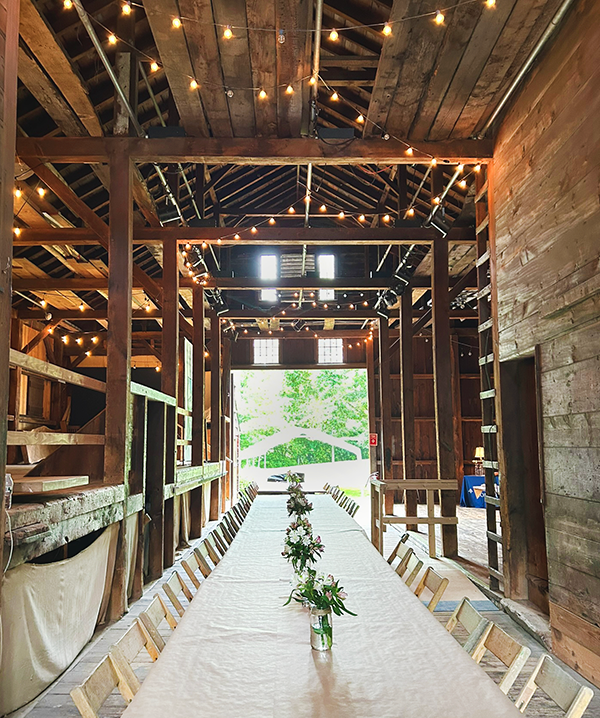 Barn inside with string lights.