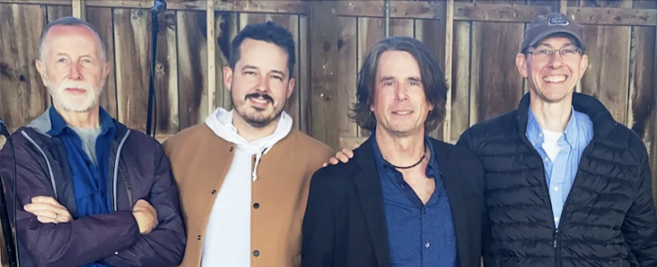 The four Kenn Morr Band members standing in a row.
