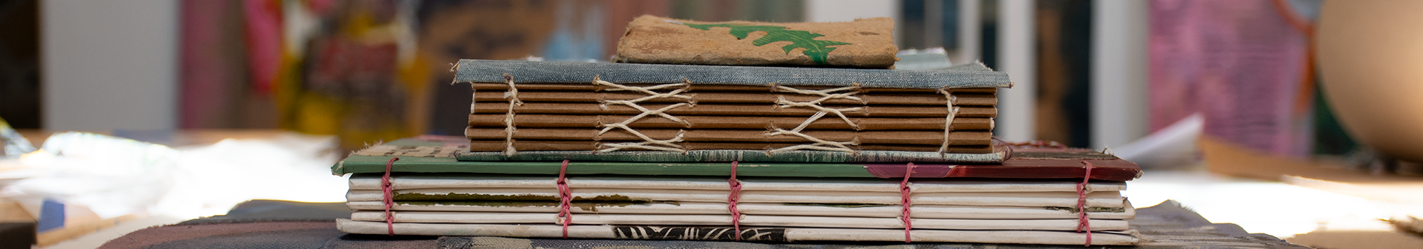 A stack of handmade books.