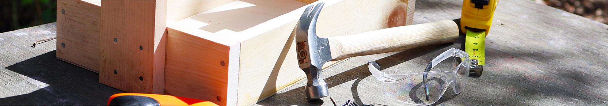 Handmade toolbox with various tools.